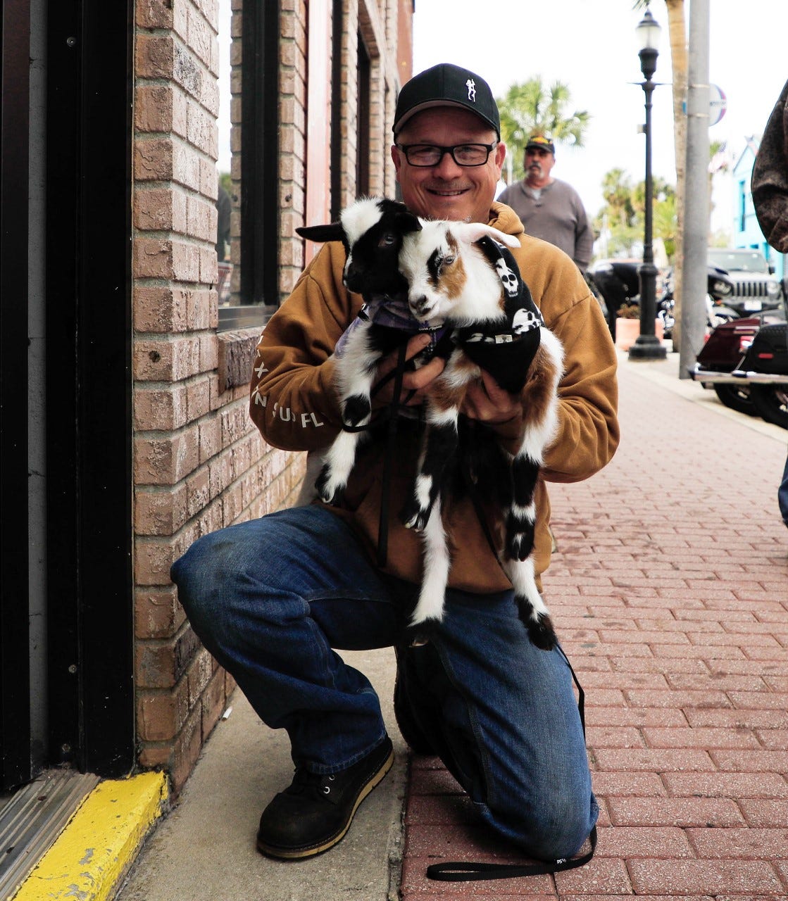 Rick Bodine and his kid goats, Sweetheart and Sparky, greet bikers and visitors on Main Street in Daytona Beach for Bike Week, Sunday, March 13, 2022.