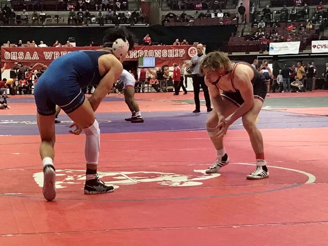 Pleasant's Daxton Chase, right, competes in the 132-pound weight class at the Division III state wrestling tournament at Ohio State's Schottenstein Center last season. Chase was named Fahey Bank Athlete of the Month for December among Marion County boys.