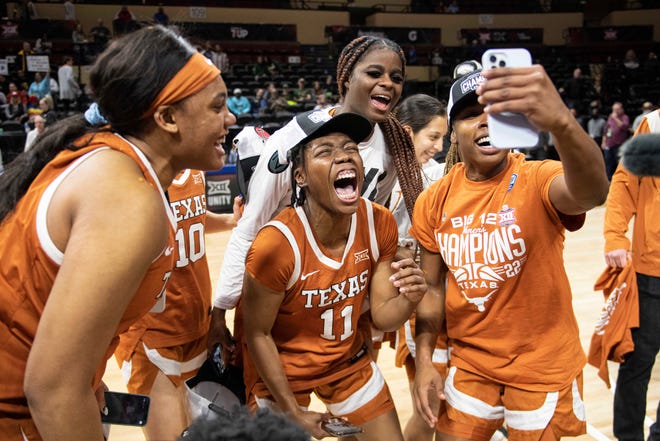Texas Longhorns guard Joanne Allen-Taylor (11) and her teammates celebrate the loss of the Baylor Lady Bears at the Municipal Auditorium.