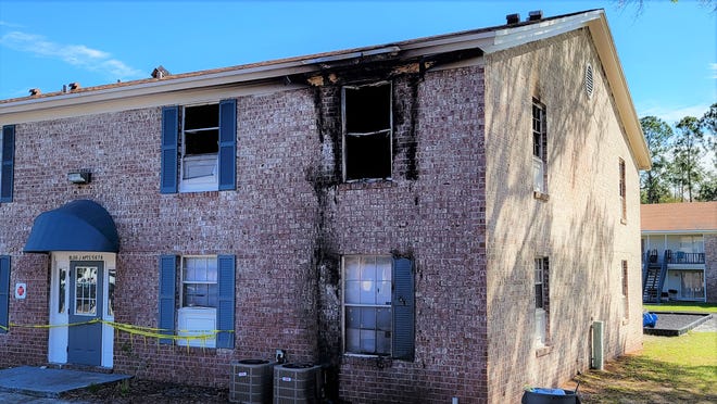 Fire damage is evident Monday following Sunday night's blaze that gutted these units at the Jacksonville Heights Apartments on 103rd Street. The Sheriff's Office said a woman is charged with arson.