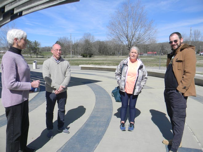 Pastor Sharon Youngs of First Presbyterian Church of Oak Ridge, Pastor Mark Flynn of First United Methodist Church of Oak Ridge, Oak Ridge Ministerial Association president Kimberly Montierth and Pastor Steve Sherman of First Christian Church (Disciples of Christ) talk after a prayer meeting for peace in Ukraine at the International Friendship Bell in Oak Ridge.