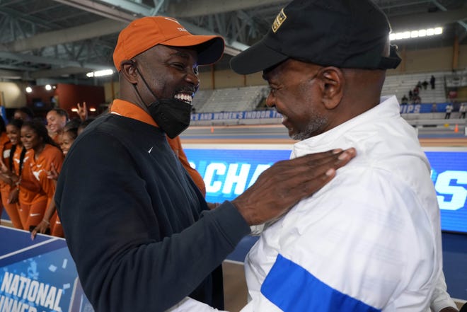 Mar 12, 2022; Birmingham, AL, USA; Florida Gators coach Mike Holloway (right) and Texas Longhorns coach Edrick Floreal embrace after their teams placed first and second in the women's teal competition during the NCAA Indoor Track and Field championships at the CrossPlex