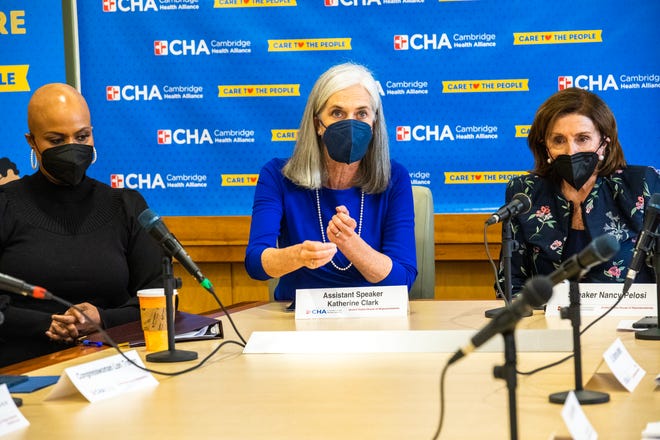 Assistant House Speaker Katherine Clark, tucked between Rep. Ayanna Pressley, left, and House Speaker Nancy Pelosi, right, speaks during a roundtable discussion in the Cambridge  Health Alliance on Saturday, March 12.