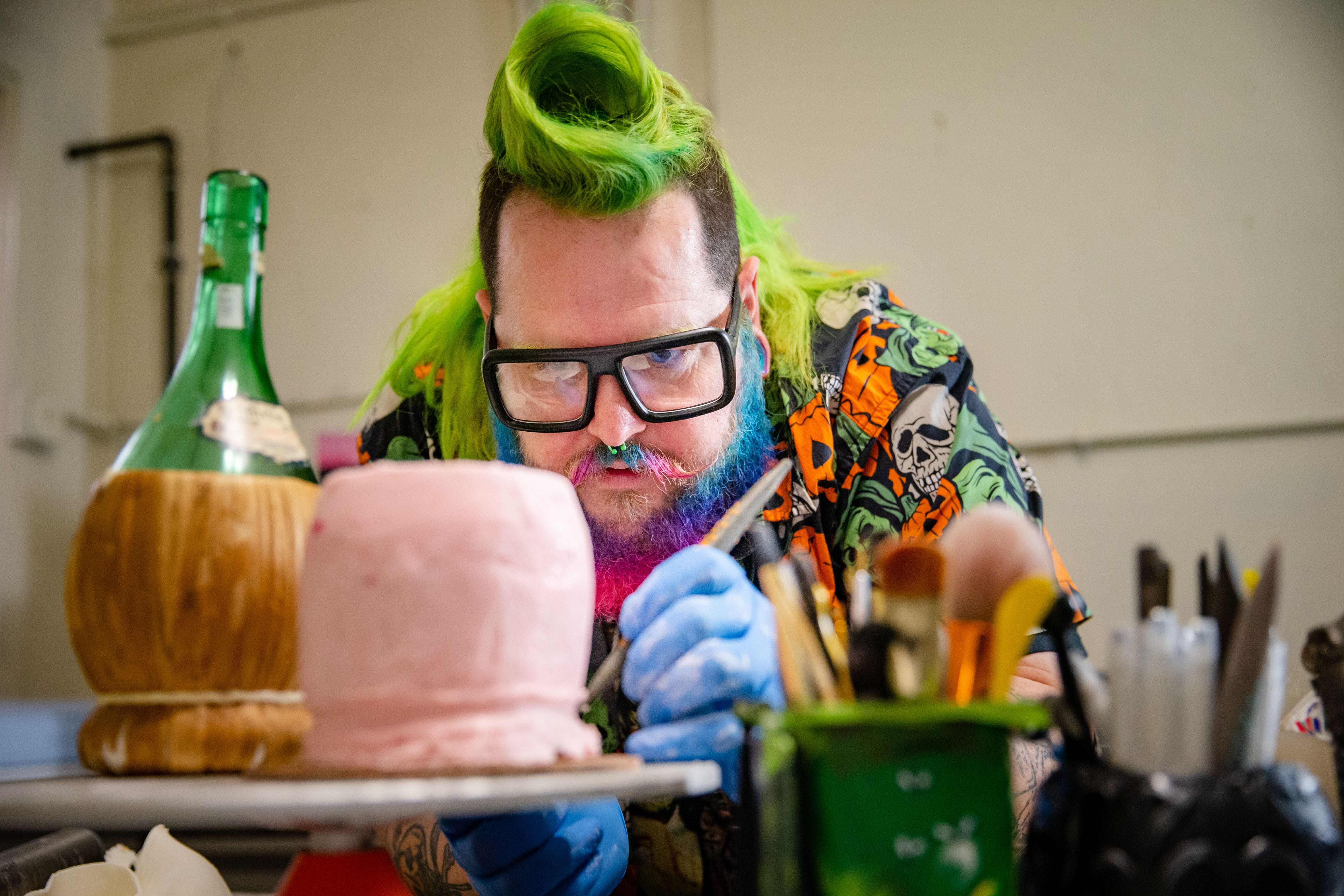 Andrew Fuller works on a cake at his baking studio, Sugar Freakshow, at 3023 S.W. Ninth St. in Des Moines, Friday, March 11, 2022.