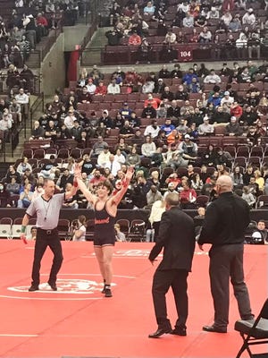 Pleasant senior Carter Chase gets his hand raised after winning the Division III 165-pound state wrestling championship this season at Ohio State's Schottenstein Center. Chase was named Fahey Bank Athlete of the Month for Marion County boys for March.
