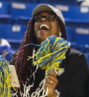 Delaware head coach Natasha Adair reacts as she learns her Hens will play Maryland as a 13 seed in the first round of the NCAA tournament during a Selection Sunday event at the Bob Carpenter Center Sunday, March 13, 2022.