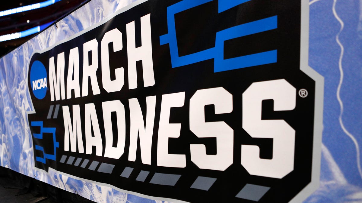 A march madness banner near the court during the practice day.