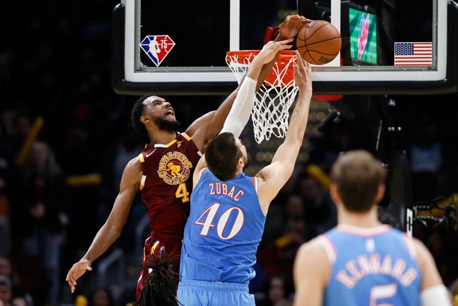 Cavaliers rookie Evan Mobley (4) blocks a shot by Los Angeles Clippers' Ivica Zubac (40) during overtime of the Cavs' 120-111 win Monday night. [Ron Schwane/Associated Press]