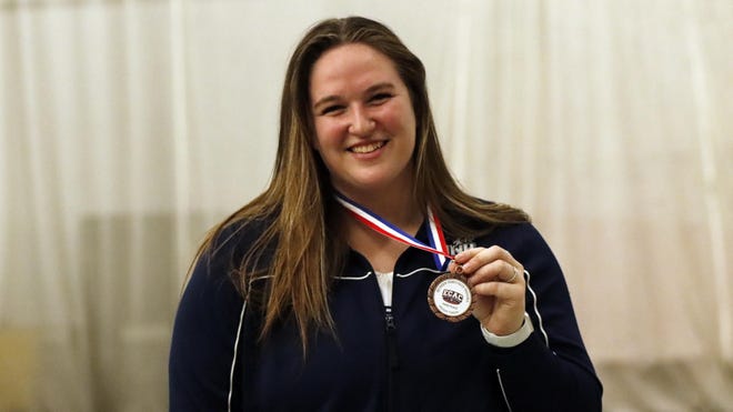 University of New Hampshire senior Sarah Williams, a 2018 graduate of Dover High School, placed third in the women's weight throw in both the recent America East and ECAC track and field championships. Pictured, she is holding her ECAC bronze medal.