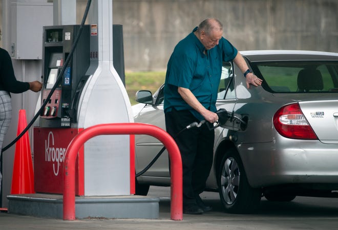 A customer fills his tank at the Kroger on I-55 N. Frontage Road in Jackson.