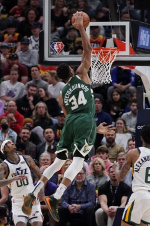 Bucks forward Giannis Antetokounmpo dunks for two of his 30 points Monday night against the Utah Jazz at Vivint Arena.