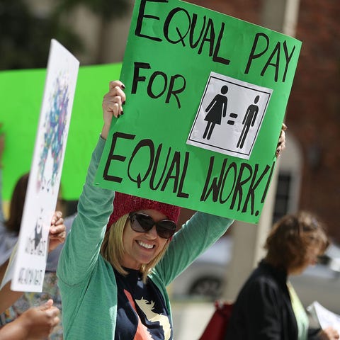 Elana Goodman joins a rally for equal pay on March