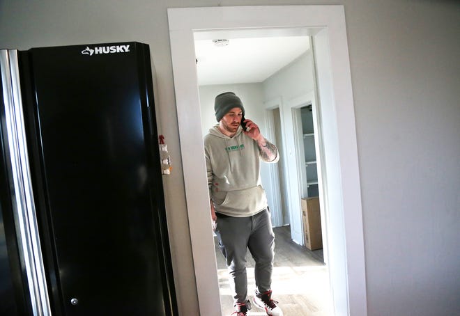 The Summerwood House is a brand new men's sober living home in Hampton. Resident Danny talks on a phone while walking through the house.