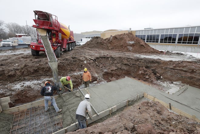 Construction continues at Lourdes Academy in Oshkosh as the Catholic school system expands its campus on North Sawyer Street in order to put all its schools under one roof.