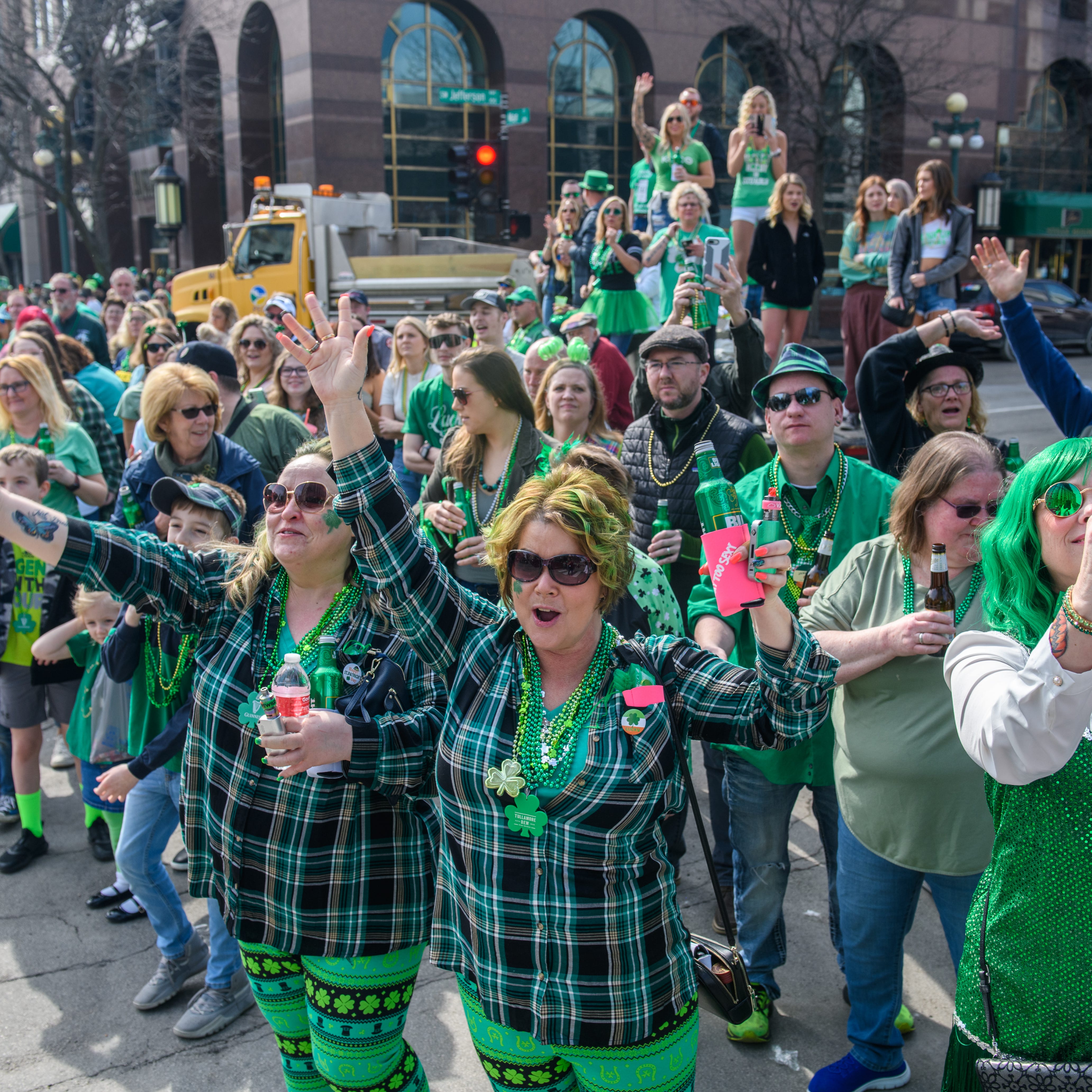 Revelers plead for beads along the route of the 2022 St. Patrick's Day Parade on Thursday, March 17, 2022 in downtown Peoria.