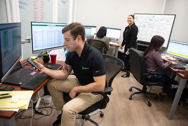 Workers in the customer service team take care of business. Green State Energy, a two-year-old Holmdel-based provider of solar energy systems. The company focuses on residential installations.   
Holmdel, NJ
Thursday, March 17, 2022.