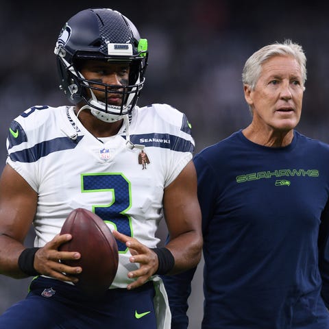 Russell Wilson and Pete Carroll before a preseason