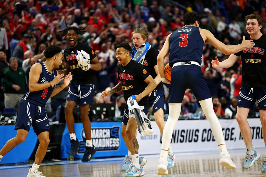 The Richmond Spiders react after their win against the Iowa Hawkeyes in the first round game of the 2022 NCAA Men's Basketball Tournament at KeyBank.