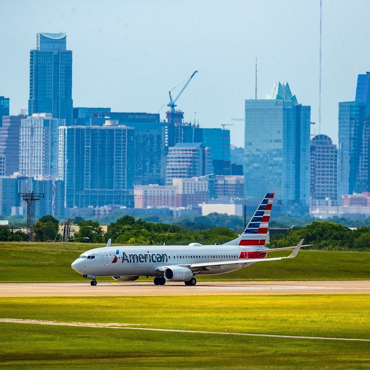 An American Airlines jet taxis on the runway at Austin-Bergstrom International Airport in 2021. American Airlines CEO Doug Parker says Austin "is very much part of our growth plan."