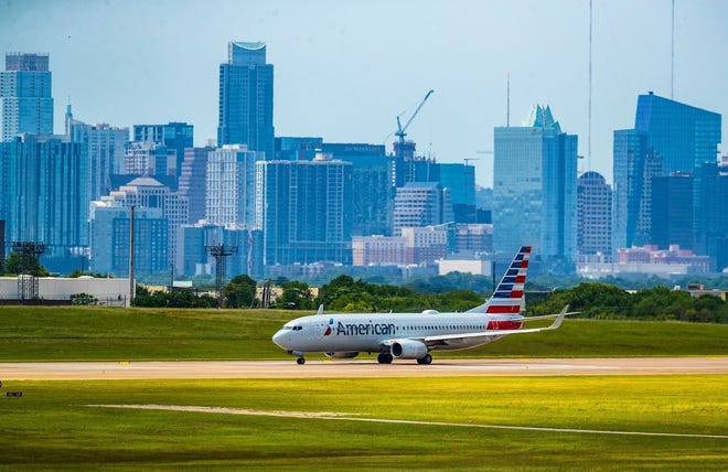An American Airlines jet taxis on the runway at Austin-Bergstrom International Airport in 2021. American Airlines CEO Doug Parker says Austin "is very much part of our growth plan."