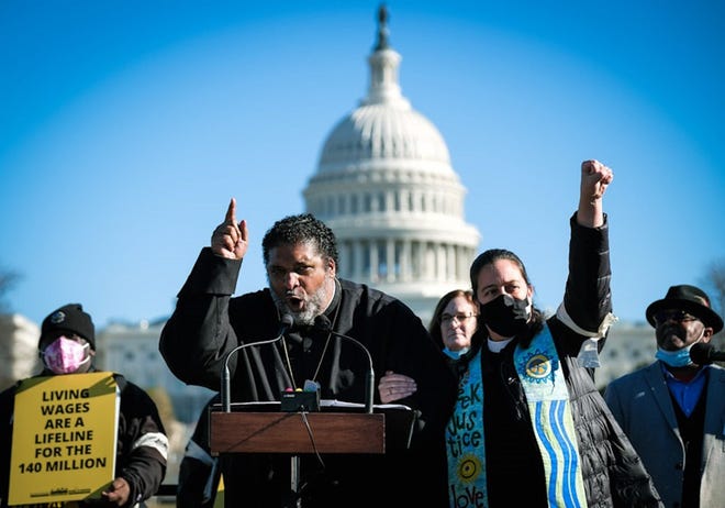 Rev. William J. Barber, left, speaks at a Moral March on Washington on Dec. 13, 2021 in Washington, D.C. (Submitted)