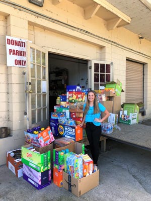 Teen Miss Leesburg, Reese Ponds, dropping off food donations at the Leesburg Food Bank.