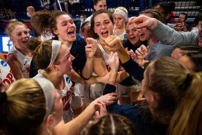 The Hope women's basketball team celebrate their win over conference rival Trine during the NCAA Final Four Thursday, March 17, 2022, at UPMC Cooper Fieldhouse in Pittsburgh.