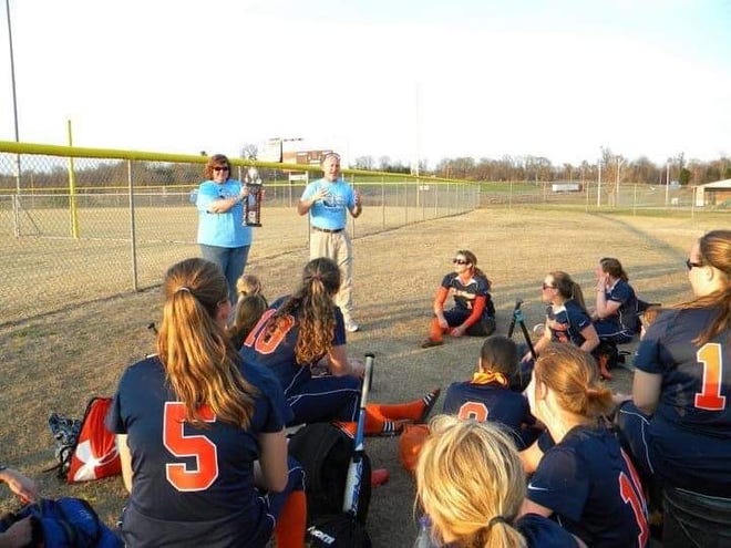 John and Tresa Whitehead talk about their daughter, Sarah Beth, with a team at a past edition of the Sarah Beth Whitehead Memorial Softball Tournament