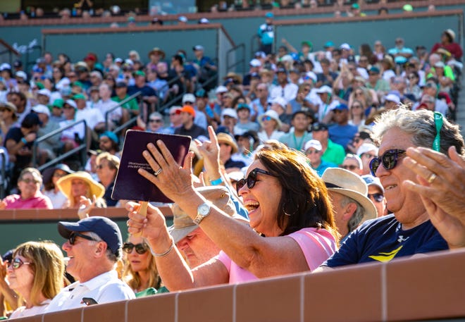 A fan cheers while watching Nick Kyrgios of Australia and Rafael Nadal of Spain play during the quarterfinals at the BNP Paribas Open at the Indian Wells Tennis Garden in Indian Wells, Calif., Thursday, March 17, 2022. 