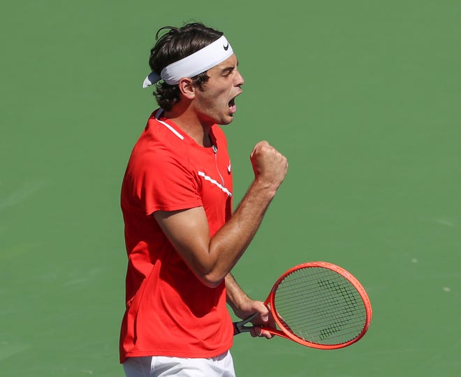 Taylor Fritz celebrates a point win during his match against Miomir Kecmanovic during the BNP Paribas Open in Indian Wells, Calif., March 18, 2022.