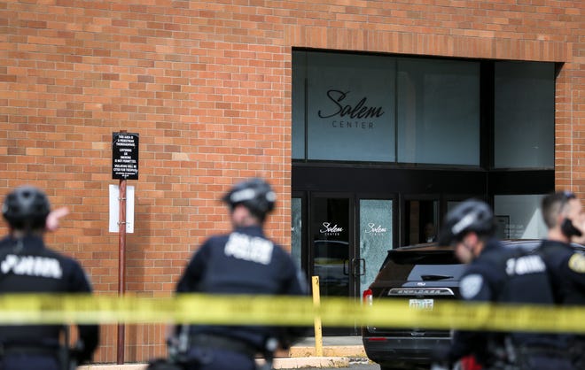 Salem Police set a perimeter around Salem Center Mall after a shooting took place on Friday, March 18, 2022 in Salem, Ore.
