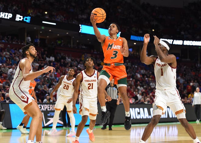 Miami Hurricanes guard Charlie Moore (3) shoots against the Southern California Trojans during their first-round game in the men's NCAA Tournament.