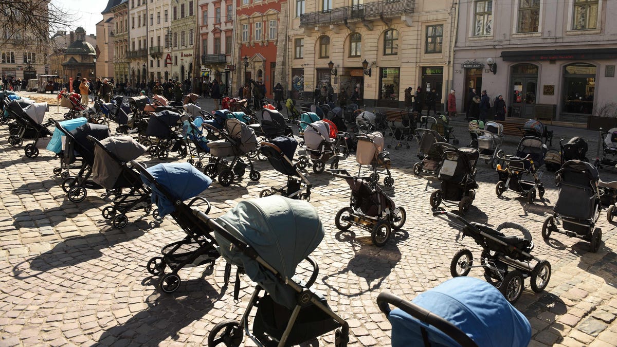 109 empty strollers placed outside the Lviv city council on March 18, 2022 commemorate the number of children killed in Russia's ongoing invasion of Ukraine.