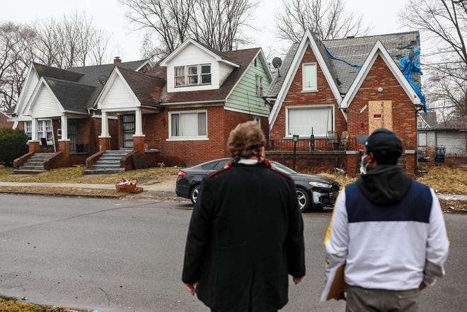 Eastside Community Network (ECN) Sustainable Housing Director Ian McCain, 28, of Eastpoint and Willie Morgan, right, volunteer of Oak Park, can save your home from property tax foreclosure on March 19, 2022 . Wayne County has resumed property tax foreclosures beginning March 31.  Nonprofits such as ECN are working with the Wayne County Treasurer to find homes for foreclosure.