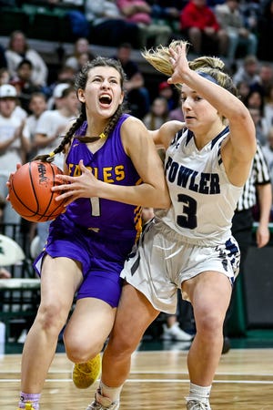 Plymouth Christian's Anna Fernandez, left, shoots as Fowler's Avery Koenigsknecht defends during the first quarter in the Division 4 state final on Saturday, March 19, 2022, at the Breslin Center in East Lansing.