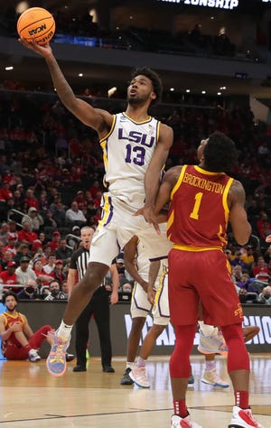 LSU forward Tari Eason (13) scores as Iowa State guard Izaiah Brockington (1) looks on during the first half in the first round game of the 2022 NCAA Men's Basketball Tournament Friday, March 18, 2022 at Fiserv Forum in Milwaukee, Wis.