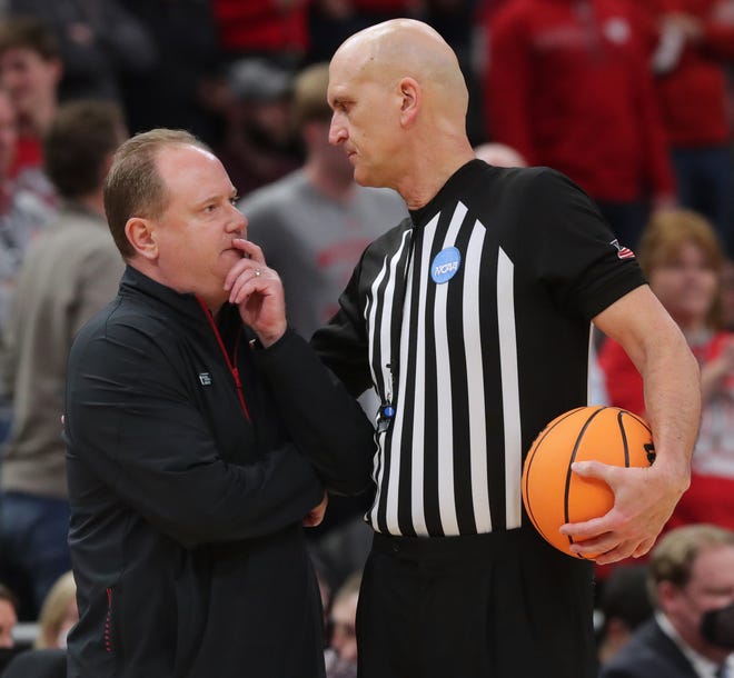 Wisconsin coach Greg Gard talks to referee D.J. Carstensen during the second half the Badgers' first-round NCAA Tournament victory over Colgate on Friday night at Fiserv Forum.