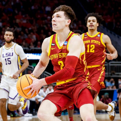 Iowa State guard Caleb Grill (2) drives to the bas