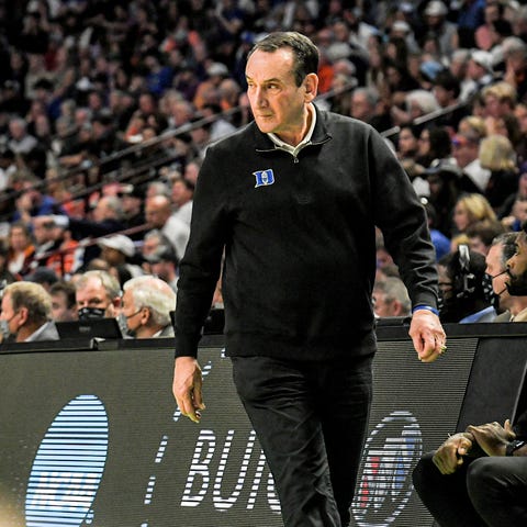 Duke University Head Coach Mike Krzyzewski walks t