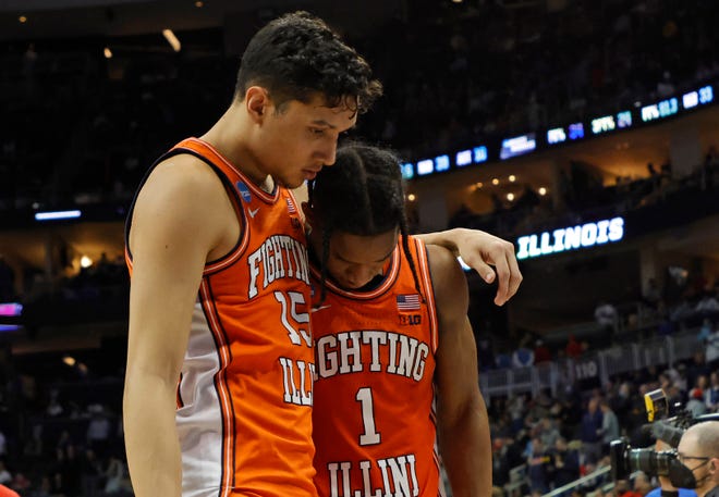 Illinois Fighting Illini guard Trent Frazier (1) reacts with guard RJ Melendez (15) after losing to the Houston Cougars during the second round of the 2022 NCAA Tournament at PPG Paints Arena.