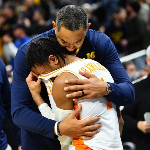 Tennessee guard Kennedy Chandler sobs in the arms 
