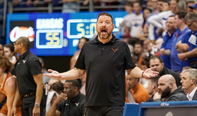 Texas coach Chris Byrd yells instructions to his players during a game last March in Kansas.  The Chris Beard era at the Longhorns lasted all 42 games.  He leaves with a 29-13 record at UT.