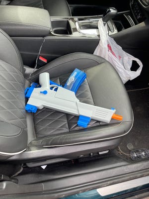 A gel-blaster gun, with a brand name of Splat Blaster, is shown on a car seat in a photo supplied on March 21, 2022 by Dearborn police, who warned against a social-media fad in which young people in vehicles fire such guns randomly at pedestrians, bringing a charge of assault this week to a Dearborn teen. (Photo: Dearborn police)