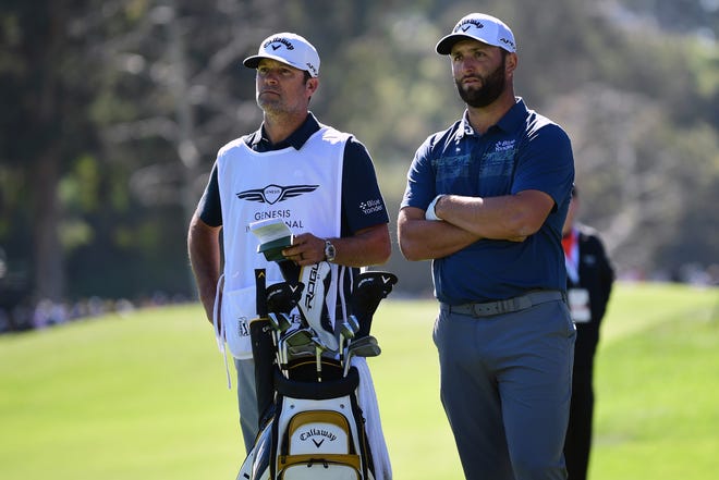 Jon Rahm speaks with caddie Adam Hayes during the second round of the 2022 Genesis Invitational in Pacific Palisades, California. (Photo by Gary A. Vasquez-USA TODAY Sports)