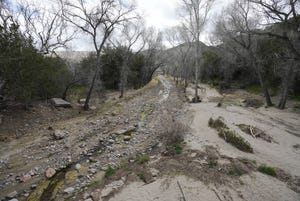 Water trickles in Pinto Creek near Miami, Ariz.