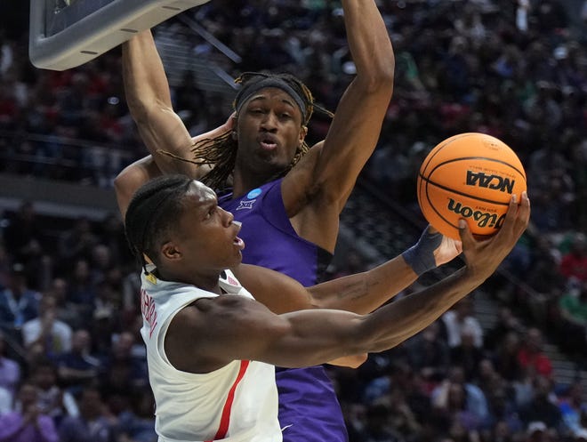 Second round: Arizona guard Bennedict Mathurin (0) drives for the up-and-under layup against TCU defender Damion Baugh (10) during the Wildcats' thrilling 85-80 win.