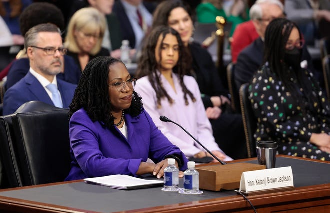 Justice Ketanji Brown Jackson during her Supreme Court confirmation hearing on March 21, 2022. Behind her, from left, are her husband Patrick Jackson and daughters Leila and Talia.