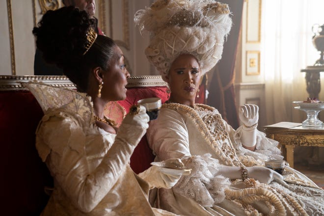 Queen Charlotte (Golda Rosheuvel, right) remains as glued as ever to Lady Whistledown's writings, and reveals a bit more why this season.  Also pictured: Adjoa Andoh as Lady Danbury.