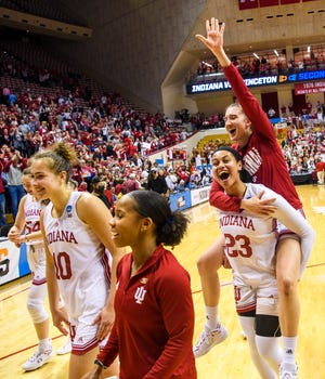 Indiana's Kiandra Browne (23) gives a piggy back ride to Mona Zaric (24) as they head off the floor after winning the Indiana versus Princeton women's NCAA second round game at Simon Skjodt Assembly Hall on Monday, March 21, 2022.
