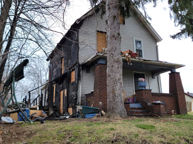 Fire destroyed this Scoville Avenue SW home Saturday afternoon, sending the couple who live there into the street. Firefighters are trying to determine the cause of the blaze as it remains under investigation.